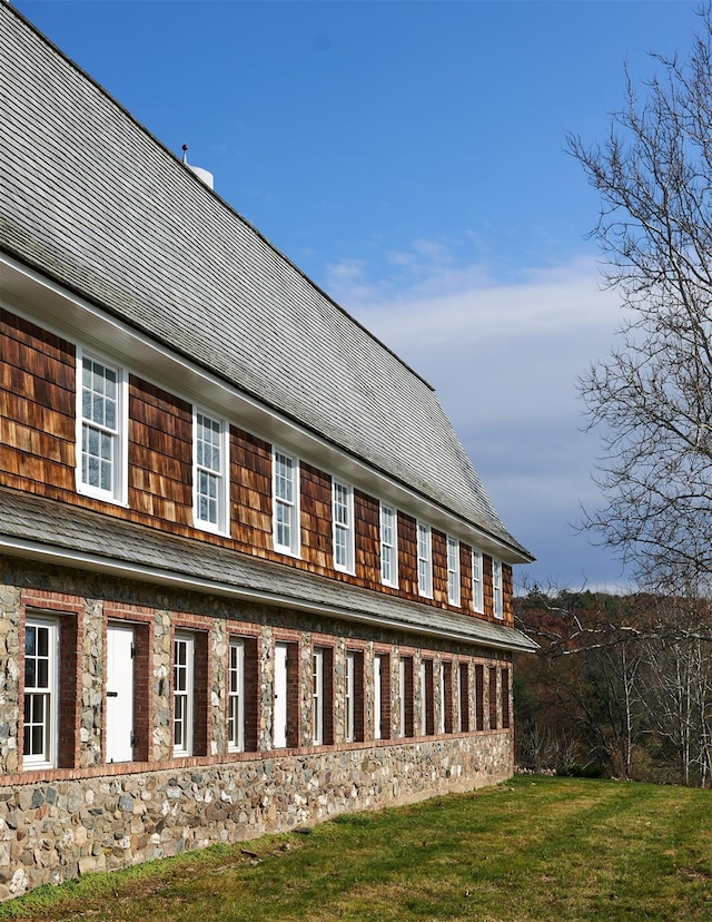 view of side of home featuring a yard