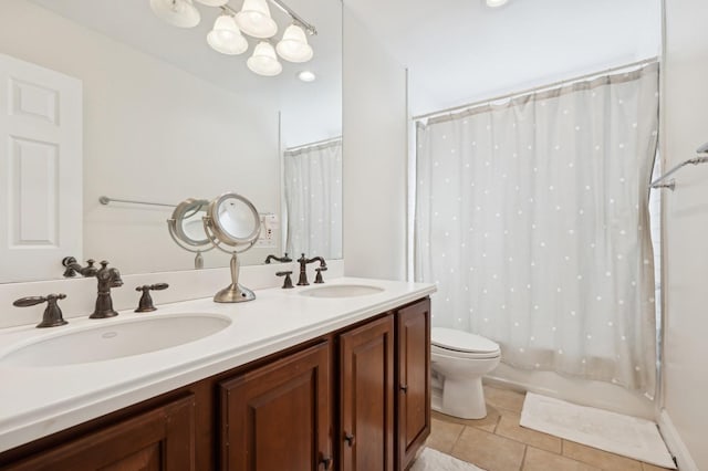 full bathroom with tile patterned floors, vanity, shower / bath combination with curtain, and toilet