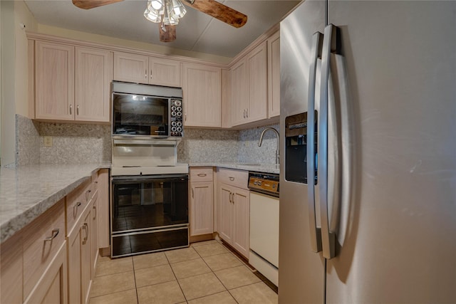 kitchen featuring dishwasher, light tile patterned floors, electric range, stainless steel refrigerator with ice dispenser, and light brown cabinets