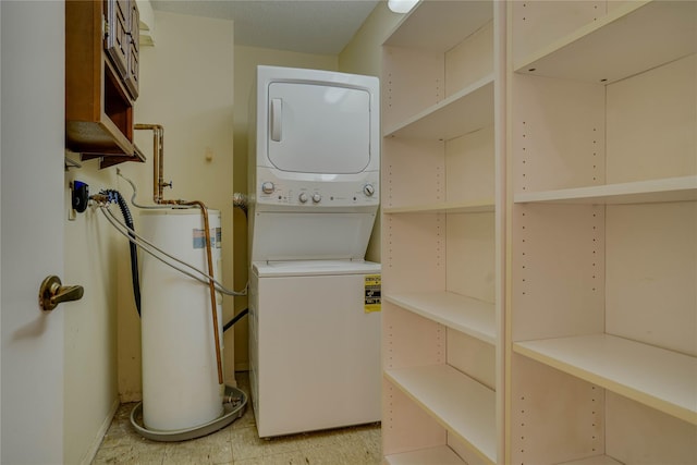 clothes washing area with water heater and stacked washing maching and dryer