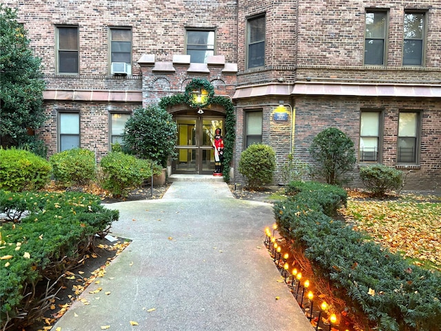 view of exterior entry with french doors and cooling unit