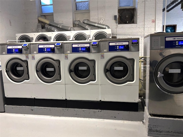 clothes washing area featuring independent washer and dryer