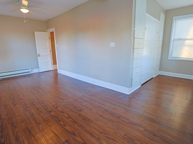 unfurnished room featuring ceiling fan, dark hardwood / wood-style flooring, and a baseboard radiator