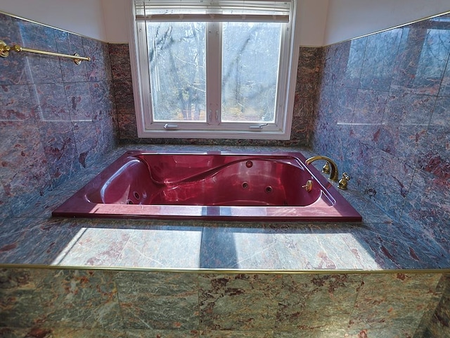 bathroom featuring a tub to relax in