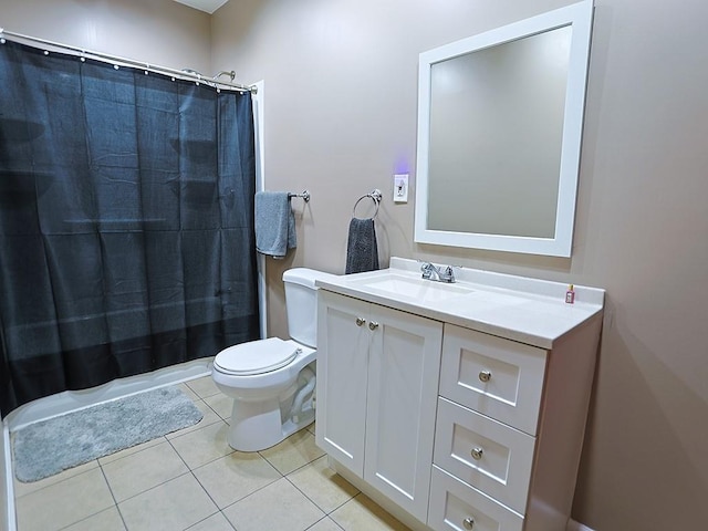 full bathroom with tile patterned flooring, vanity, toilet, and shower / bath combo with shower curtain