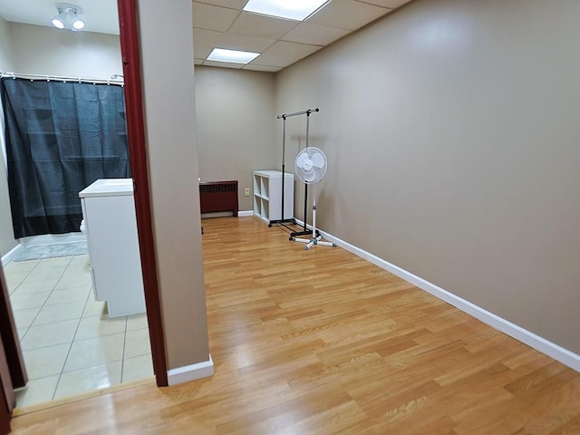 washroom featuring light hardwood / wood-style flooring and radiator