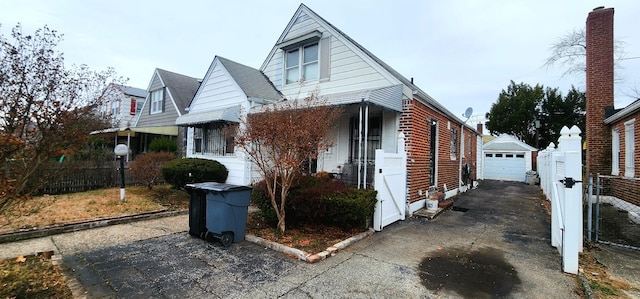 view of front facade with an outdoor structure and a garage