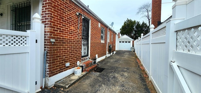 view of home's exterior with an outbuilding and a garage