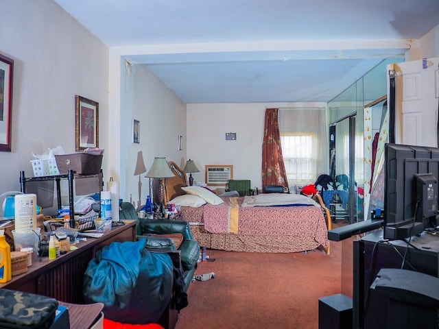 carpeted bedroom with beam ceiling