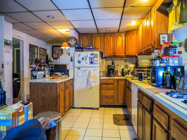 kitchen with light tile patterned floors and white appliances