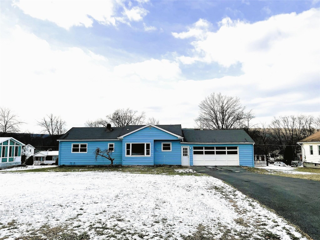 ranch-style home with a garage