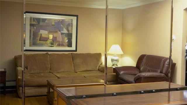 living room with a baseboard heating unit, ornamental molding, and dark hardwood / wood-style floors