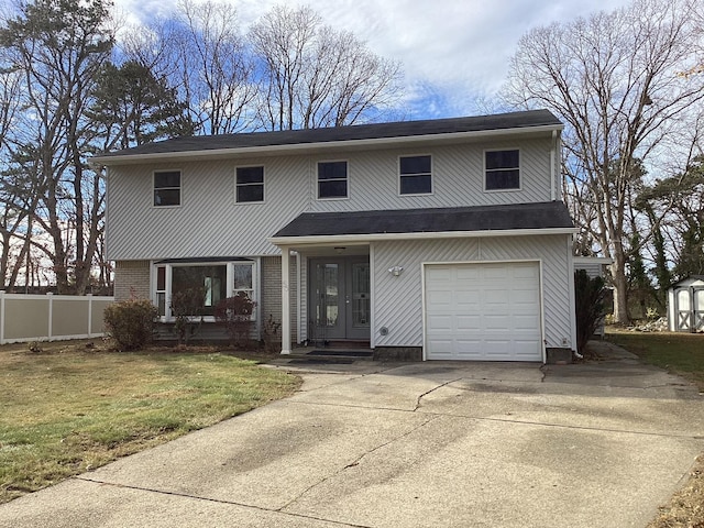 view of front of house featuring a garage, a front yard, and french doors