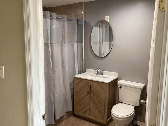 bathroom featuring walk in shower, tile patterned flooring, vanity, and toilet