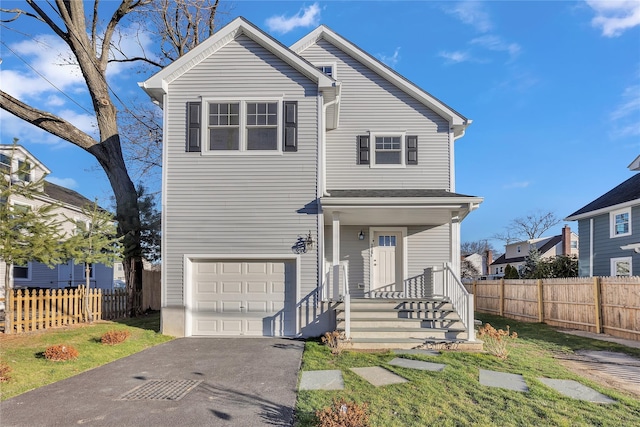 front of property with a garage and a front yard