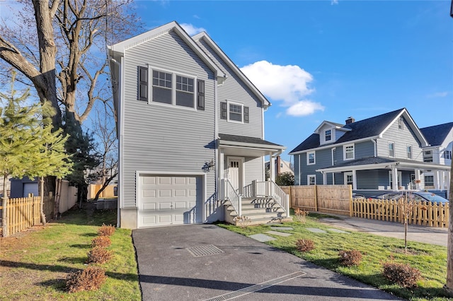 front of property featuring a garage