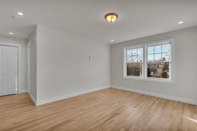 spare room with light wood-type flooring