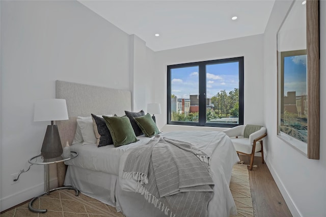 bedroom with hardwood / wood-style floors