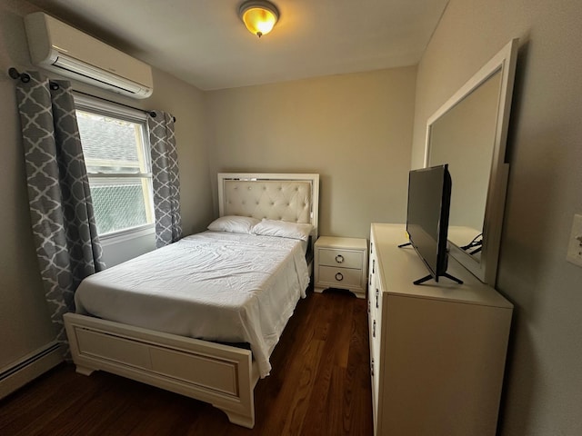 bedroom featuring a wall unit AC, dark hardwood / wood-style flooring, and baseboard heating