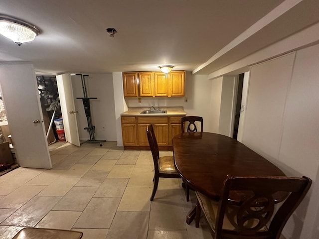 tiled dining room with sink