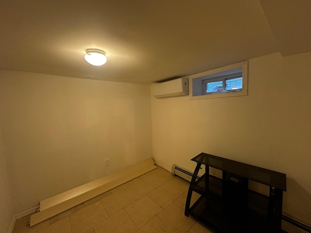 basement with an AC wall unit and light tile patterned flooring