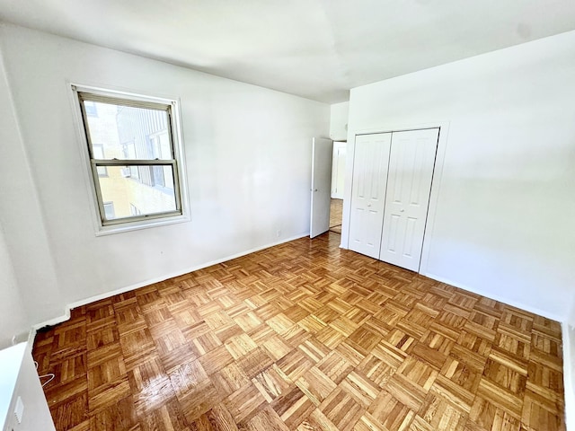 unfurnished bedroom with light parquet floors