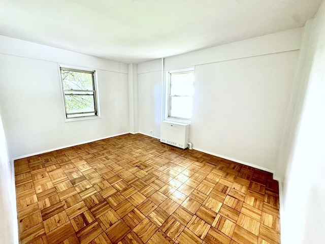 spare room with light parquet flooring