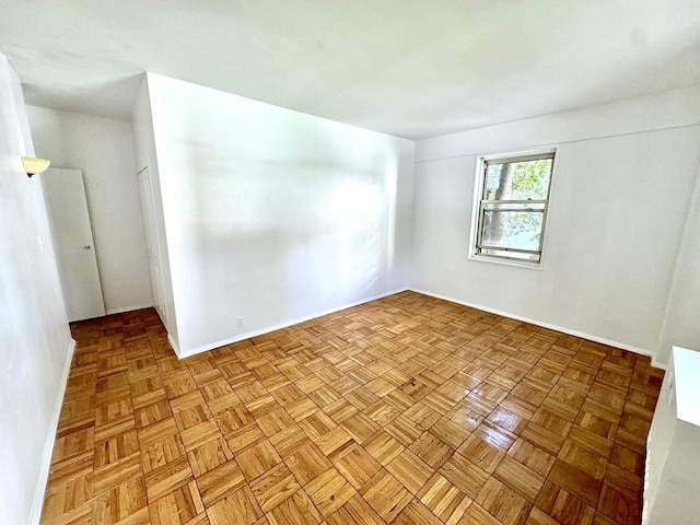 empty room with light parquet flooring