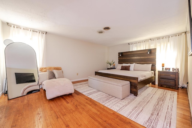 bedroom with light hardwood / wood-style flooring