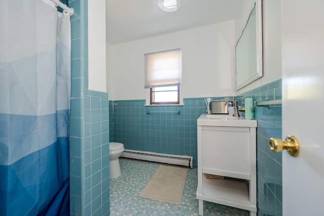 bathroom featuring baseboard heating, a shower with curtain, tile patterned flooring, vanity, and tile walls