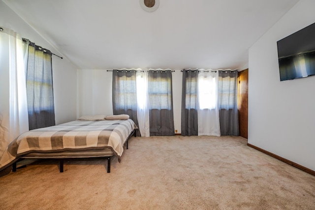 bedroom with light colored carpet