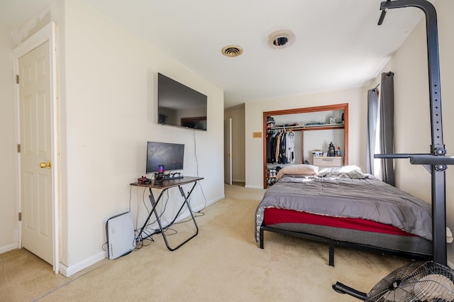 carpeted bedroom with a closet