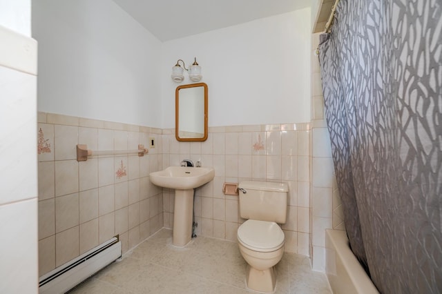 151 Burrows Ln, Blauvelt, NY 10913 - full bathroom featuring baseboard heating, shower / tub combo with curtain, wainscoting, tile patterned floors, and tile walls
