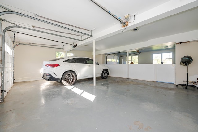 garage featuring a carport and a garage door opener