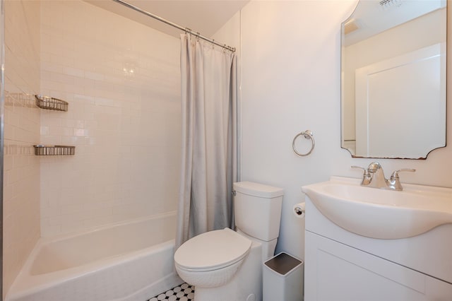 full bathroom featuring tile patterned flooring, vanity, toilet, and shower / bathtub combination with curtain