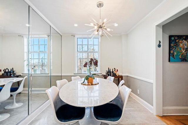 dining area with an inviting chandelier and crown molding