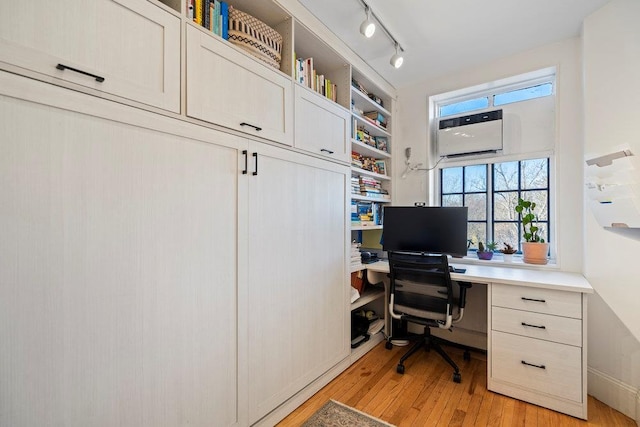 office area featuring light hardwood / wood-style flooring and track lighting