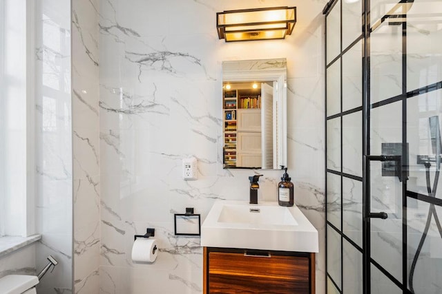 bathroom featuring walk in shower, vanity, and toilet