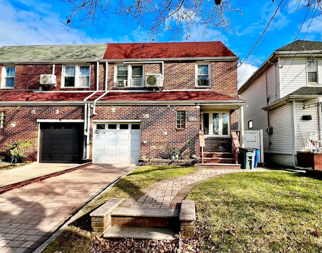 view of front of home with a front yard and a garage