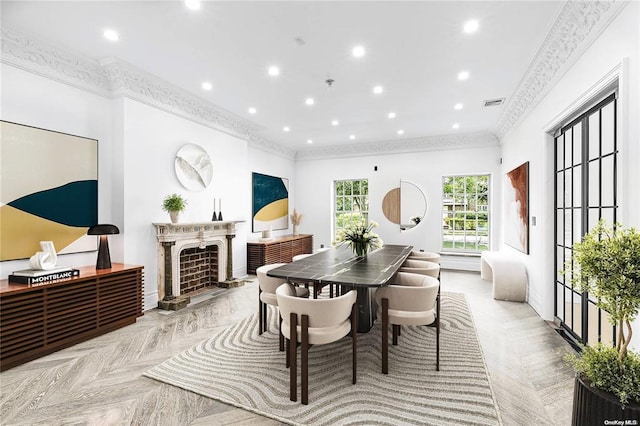 dining room featuring light parquet floors and crown molding