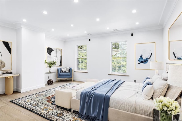 bedroom featuring light hardwood / wood-style flooring and ornamental molding