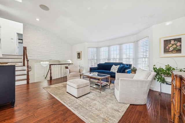 living room with vaulted ceiling and dark hardwood / wood-style floors