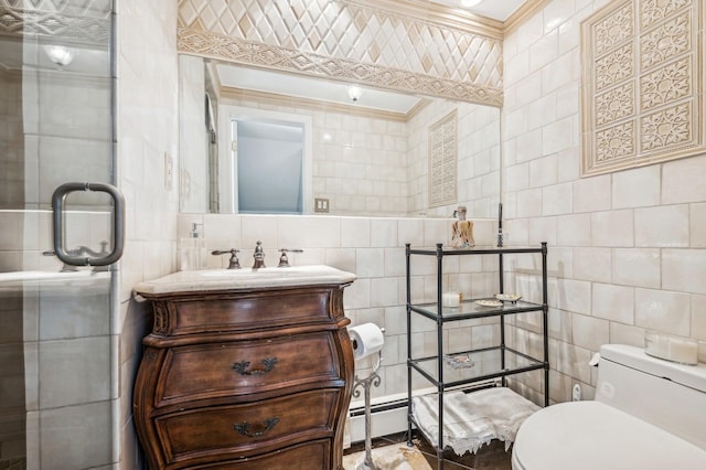 bathroom with ornamental molding, vanity, toilet, and tile walls