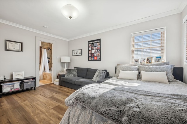 bedroom featuring crown molding and hardwood / wood-style flooring