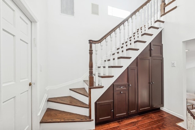 staircase featuring hardwood / wood-style flooring