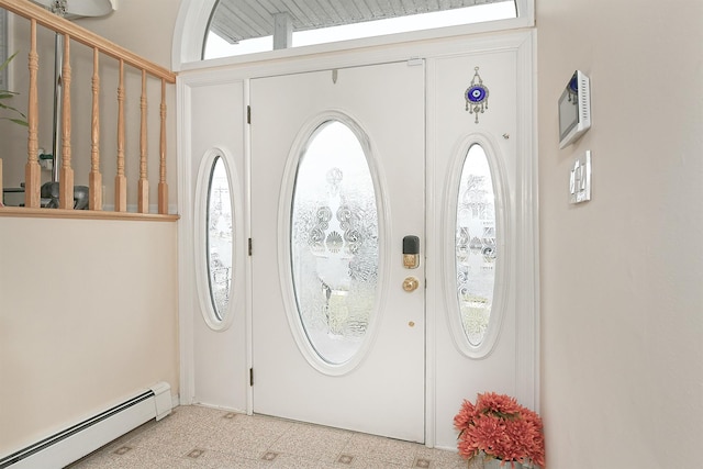 foyer entrance featuring baseboard heating