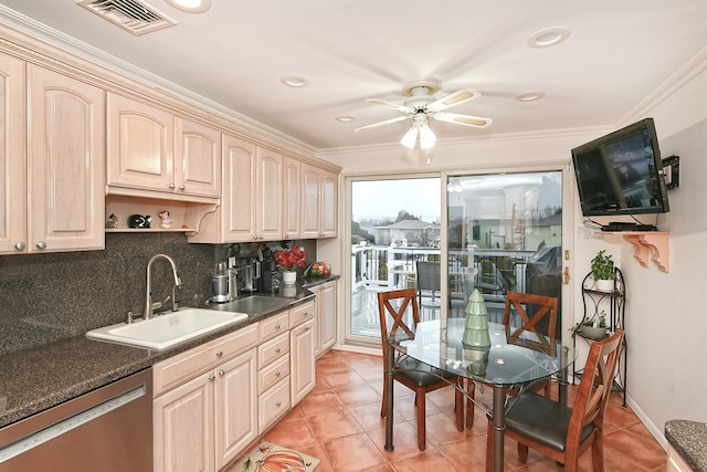 kitchen featuring crown molding, sink, light tile patterned floors, light brown cabinets, and dishwasher