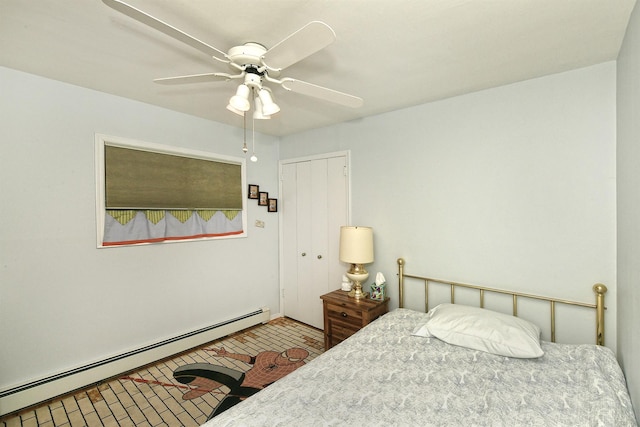 bedroom featuring ceiling fan, a closet, and a baseboard radiator