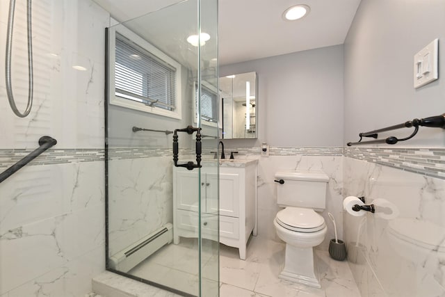 bathroom with a baseboard heating unit, an enclosed shower, toilet, vanity, and tile walls