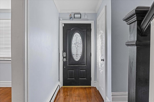 entryway with dark hardwood / wood-style flooring and ornamental molding